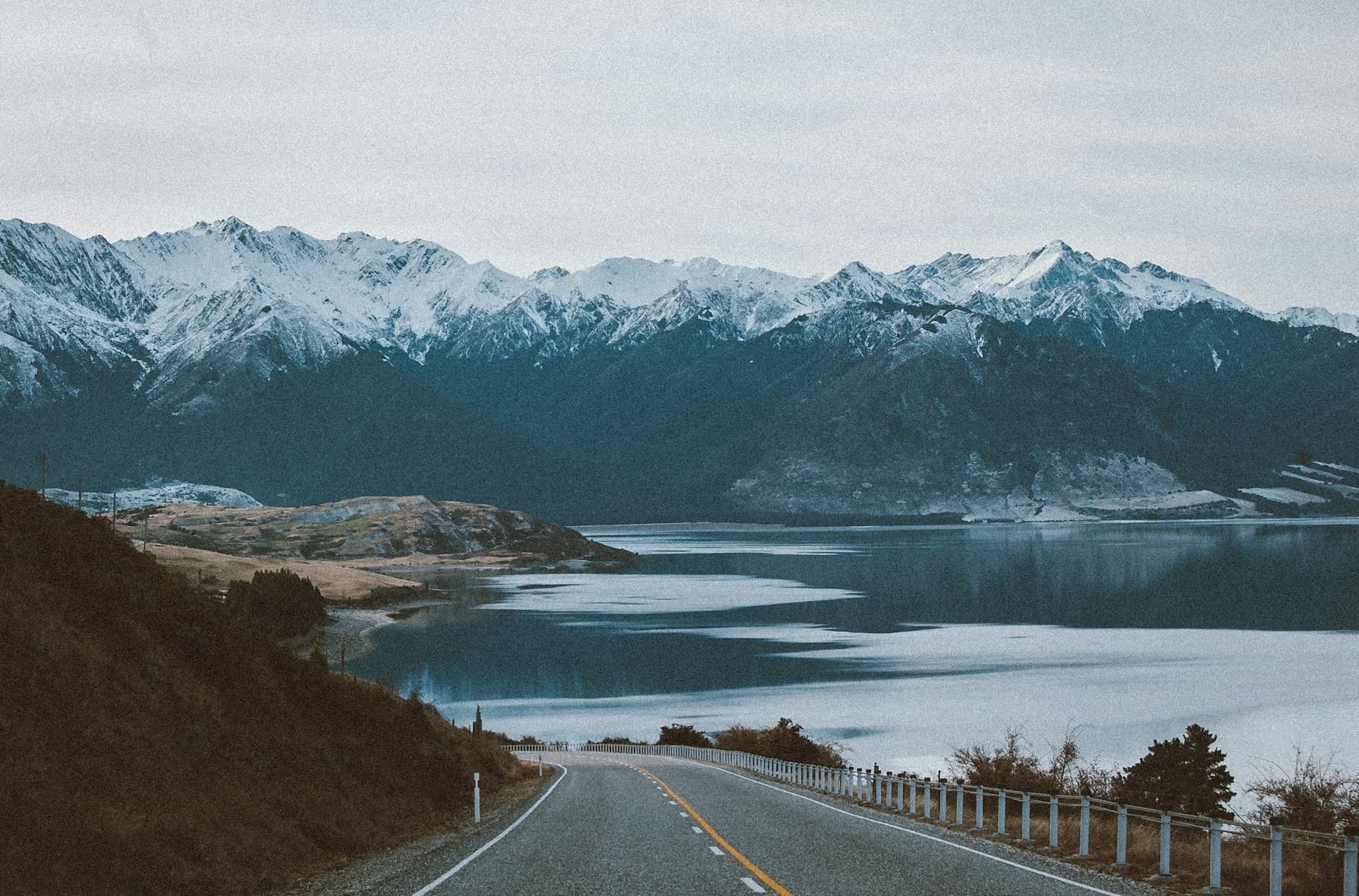 Alaska road with mountains in the background. 