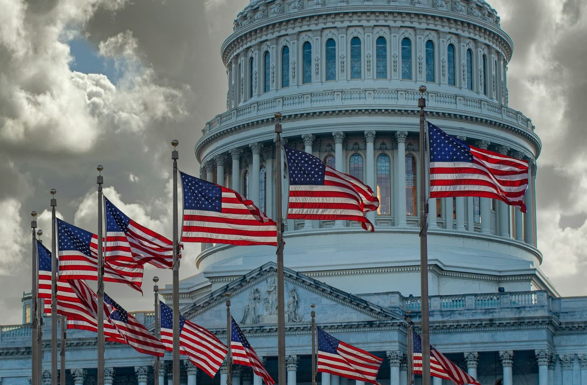 US Capitol Building with American Flags in front. 